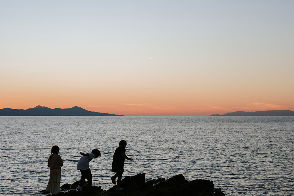 Kids running in the sunset